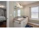 Bathroom featuring a double sink vanity, ample storage, and a large mirror at 298 Upper Stanley Rd, Stanley, NC 28164