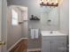 Well-lit bathroom featuring a sink, vanity, and a mirror, providing a clean and functional space at 298 Upper Stanley Rd, Stanley, NC 28164