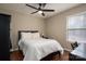 Cozy bedroom with hardwood floors, ceiling fan, and natural light at 298 Upper Stanley Rd, Stanley, NC 28164