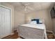 Comfortable bedroom with a wooden bed frame, soft lighting, and a ceiling fan, creating a relaxing retreat at 298 Upper Stanley Rd, Stanley, NC 28164