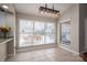 Bright dining area featuring neutral tones, tile floors, and a window overlooking the outdoor patio at 298 Upper Stanley Rd, Stanley, NC 28164