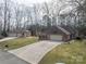 Exterior shot of a house with a detached garage and a large yard at 298 Upper Stanley Rd, Stanley, NC 28164