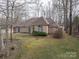 Lovely brick home featuring a well-manicured lawn and mature trees providing shade and curb appeal at 298 Upper Stanley Rd, Stanley, NC 28164