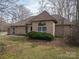 Charming brick home with a well-maintained lawn and mature landscaping for great curb appeal at 298 Upper Stanley Rd, Stanley, NC 28164