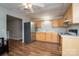 Cozy kitchen featuring wood cabinets, laminate countertops and stainless steel refrigerator at 298 Upper Stanley Rd, Stanley, NC 28164