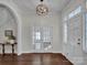 Elegant entryway with hardwood floors, double doors, and a chandelier at 301 S Washington St, Monroe, NC 28112