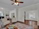 Bright living room with hardwood floors, comfortable seating, and access to other rooms at 301 S Washington St, Monroe, NC 28112