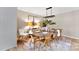 Dining room with a rustic wooden table and crystal chandelier at 3013 Southampton Cir, Gastonia, NC 28056