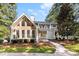 Gray house with stone accents and double doors, nicely landscaped at 3013 Southampton Cir, Gastonia, NC 28056