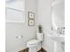 Elegant powder room with a pedestal sink, decorative art and modern fixtures at 3038 Finchborough Ct # 234, Charlotte, NC 28269