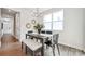 Modern dining room with lots of natural light and contemporary chandelier and decor at 3038 Finchborough Ct # 234, Charlotte, NC 28269