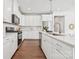 Spacious kitchen with stainless steel appliances and lots of white cabinets at 3038 Finchborough Ct # 234, Charlotte, NC 28269