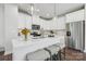 Bright kitchen featuring stainless steel appliances, quartz countertops, and barstool seating at 3038 Finchborough Ct # 234, Charlotte, NC 28269