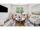 Cozy living room filled with natural light and stylish furniture at 3038 Finchborough Ct # 234, Charlotte, NC 28269
