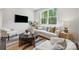 Bright living room with large windows and comfortable seating arrangement at 3038 Finchborough Ct # 234, Charlotte, NC 28269