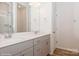 Modern bathroom with dual vanity, shower, and grey cabinets at 33 Woodsdale Se Pl, Concord, NC 28025