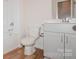 Bathroom with a toilet, bathtub, and grey vanity at 33 Woodsdale Se Pl, Concord, NC 28025