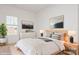 Bright bedroom with a queen bed, neutral decor, and large window at 33 Woodsdale Se Pl, Concord, NC 28025