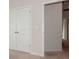 Bedroom with double doors leading to hallway and additional space at 33 Woodsdale Se Pl, Concord, NC 28025