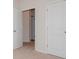 Bright bedroom with two closets and neutral carpeting at 33 Woodsdale Se Pl, Concord, NC 28025