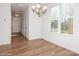 Bright dining room with hardwood floors and access to the front entry at 33 Woodsdale Se Pl, Concord, NC 28025