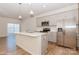 Modern kitchen with stainless steel appliances and an island at 33 Woodsdale Se Pl, Concord, NC 28025