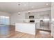 Modern kitchen with stainless steel appliances and an island at 33 Woodsdale Se Pl, Concord, NC 28025