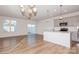 Open kitchen with gray cabinets, an island, and stainless steel appliances at 33 Woodsdale Se Pl, Concord, NC 28025