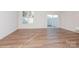 Spacious living area with hardwood floors and sliding glass doors at 33 Woodsdale Se Pl, Concord, NC 28025