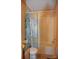 Clean bathroom with shower/tub combo and floral shower curtain at 3300 Bendwood Rd, Newton, NC 28658