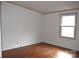 Simple bedroom with hardwood floors and large window at 3300 Bendwood Rd, Newton, NC 28658