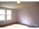 Simple bedroom with carpeted floors and large window at 3300 Bendwood Rd, Newton, NC 28658