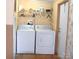 Laundry room with washer, dryer, and overhead storage at 3300 Bendwood Rd, Newton, NC 28658