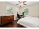 Bedroom featuring hardwood floors, a ceiling fan, and an office workspace at 3531 Enfield Rd, Charlotte, NC 28205