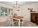 Cozy dining room featuring a rustic table and comfortable seating for four at 3531 Enfield Rd, Charlotte, NC 28205