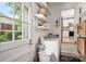 Laundry room with washer and dryer hookups, shelving, and natural light at 3531 Enfield Rd, Charlotte, NC 28205