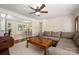 Spacious living room with hardwood floors, open to the dining area at 3531 Enfield Rd, Charlotte, NC 28205