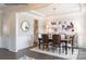 Bright dining room with a chandelier, dark wood table, and a view into adjacent room at 3531 Rapport Ct # 024, Lancaster, SC 29720