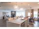 Modern kitchen with a large island, white cabinets, and stainless steel appliances at 3531 Rapport Ct # 024, Lancaster, SC 29720