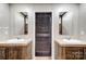 Bathroom features a dual sink vanity with framed mirrors and updated fixtures at 354 Baptist Church Rd, Gold Hill, NC 28071