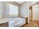 Relaxing bath area with a modern tub, storage, and clean lines, creating a spa-like experience at 354 Baptist Church Rd, Gold Hill, NC 28071