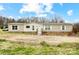 Single-story home featuring neutral siding, white windows, and a small front porch at 354 Baptist Church Rd, Gold Hill, NC 28071