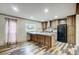 Kitchen featuring dark cabinetry, a center island with sink, and lots of natural light at 354 Baptist Church Rd, Gold Hill, NC 28071