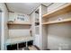 Laundry room features a folding table and open shelving for storage at 354 Baptist Church Rd, Gold Hill, NC 28071