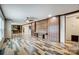 Spacious living room with custom wood paneling, ceiling fan, and open to the kitchen at 354 Baptist Church Rd, Gold Hill, NC 28071