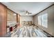 Open living space featuring custom floors, wooden accent wall and modern ceiling fan at 354 Baptist Church Rd, Gold Hill, NC 28071