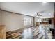 Bright living room featuring custom floors, open layout, and a view into the kitchen at 354 Baptist Church Rd, Gold Hill, NC 28071