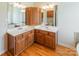 Double vanity bathroom with wood cabinets and a corner sink at 3624 Ramsey Rd, Sharon, SC 29742