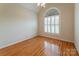 Spacious bedroom featuring hardwood floors and an arched window at 3624 Ramsey Rd, Sharon, SC 29742