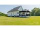 Back of house showing deck and landscaping at 3624 Ramsey Rd, Sharon, SC 29742